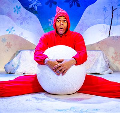 man with giant snowball