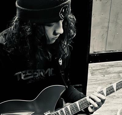 imagine of a guy playing guitar