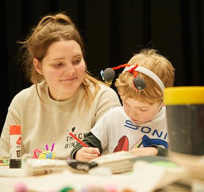 Young child taking part in a craft session
