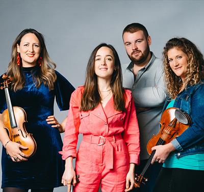 Orkney-born quartet FARA, pictured with violins