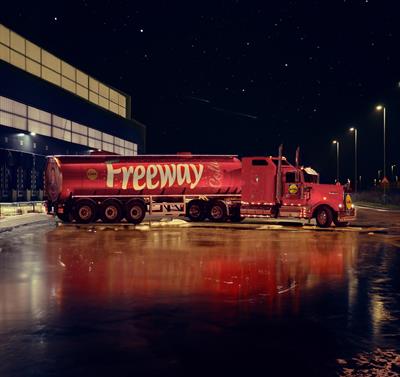 A big red truck with Lidl Freeway Cola written on the side