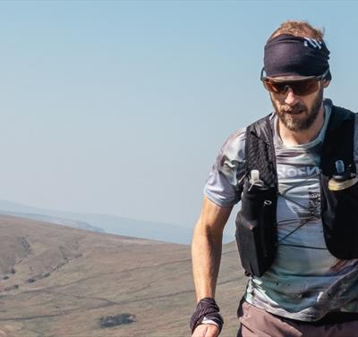 Ultrarunner Damian Hall in a remote, mountaintop setting