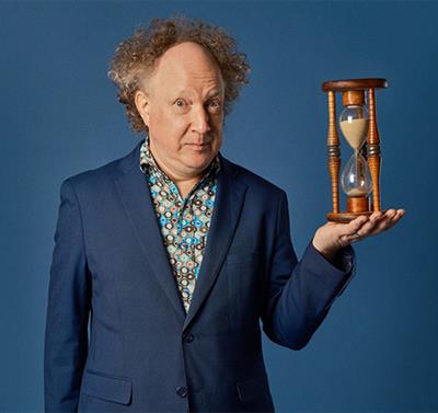 Photo of Andy Zaltzman: The Zaltgeist holding a sand timer