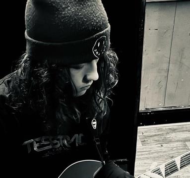 imagine of a guy playing guitar