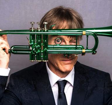 image of Paul Higgs holding a trumpet