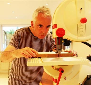 Jo FairFax using a machine