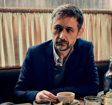 Image of the man behind the album - the divine comedy