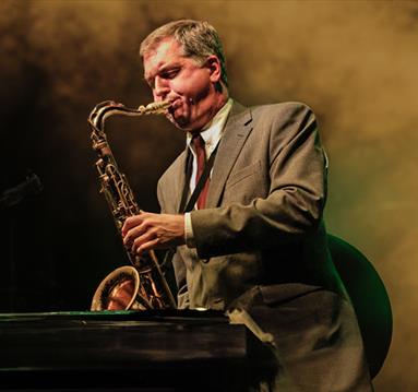 man playing saxaphone