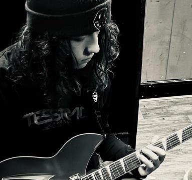 imagine of a guy playing guitar