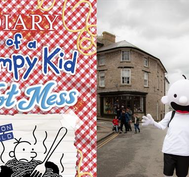 Graphic for the event including illustrations fro the book and the character of Greg Heffley come to life in a mascot sized costume