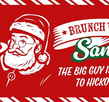 Graphic showing a cartoon santa holding a stack of pancakes