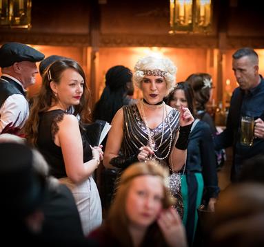 Photo of participants enjoying the murder mystery event
