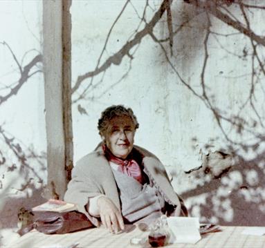 Agatha Christie relaxing during a sightseeing tour, Tajoura, Libya, 1955.