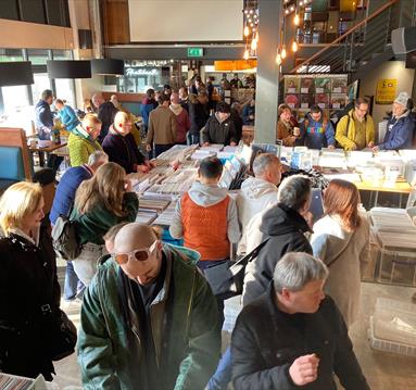 Vinyl collectors look through boxes and boxes of records