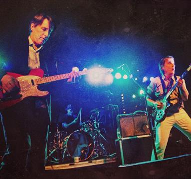 Photo of the Long Ryders performing on stage, guitars in hand