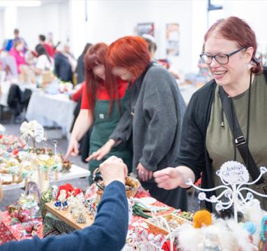 Shopper paying for an item at a Christmas market