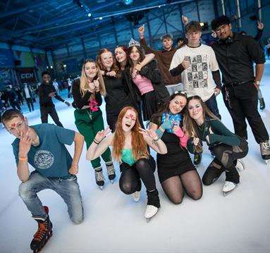 Photo of a group of teenagers at a disco party at the National Ice Centre