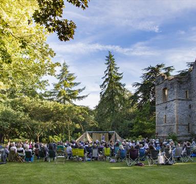 An audience seated in the Palace Gardens at Southwell Minster