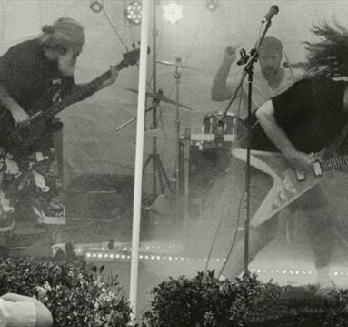 Black and white image of two electric guitarists on stage