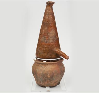 A medieval alembic, a conical shaped distillation vessel