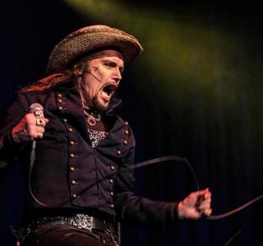 Photo of Adam Ant on stage