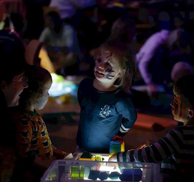 Photo of a child enjoying a sensory play area