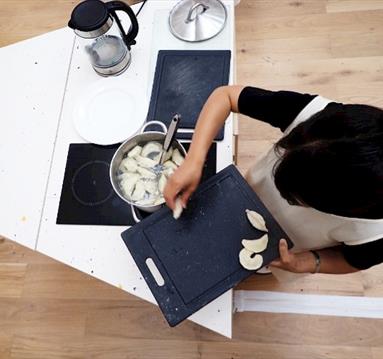 Overhead shot of a chef cooking on a hob