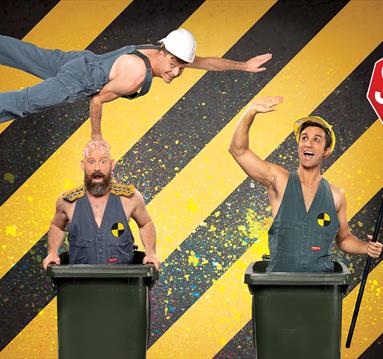 Graphic of the Trash Test Dummies Circus show featuring two of the perfromers stood in bins and the third flying above them.