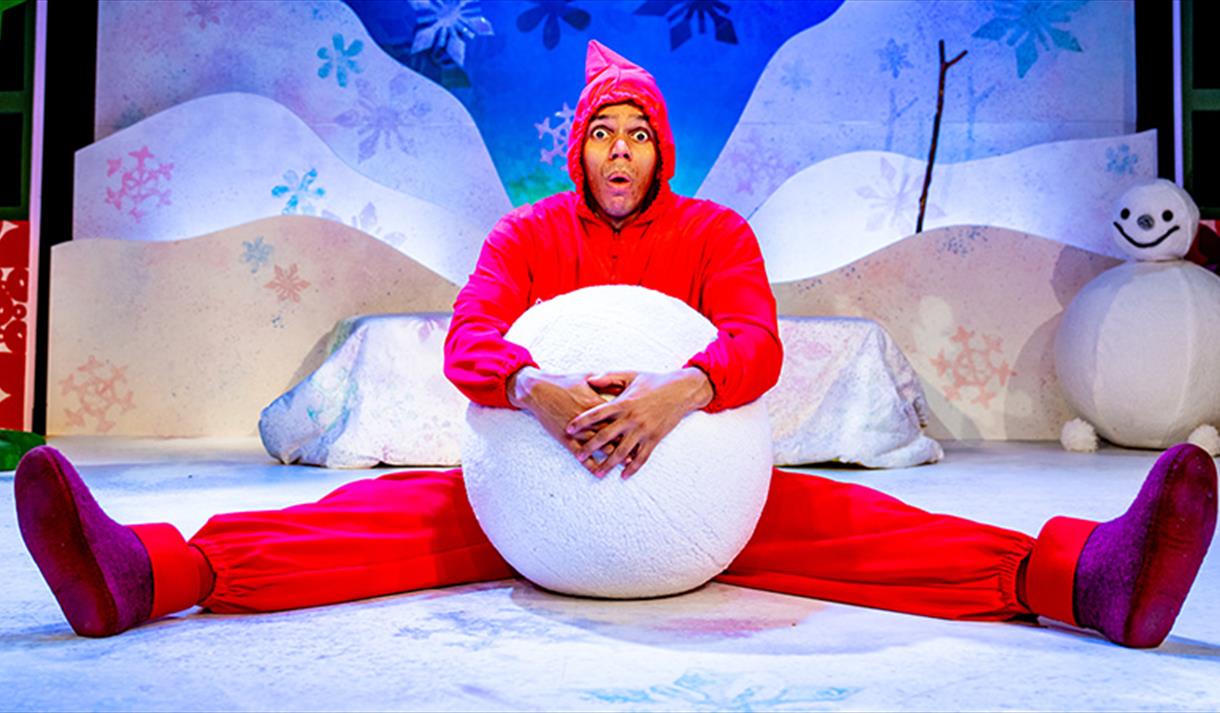 man with giant snowball