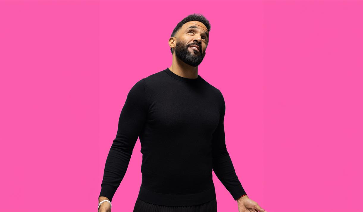 Photo of Craig David against a pink background