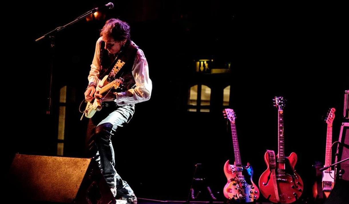 man playing guitar