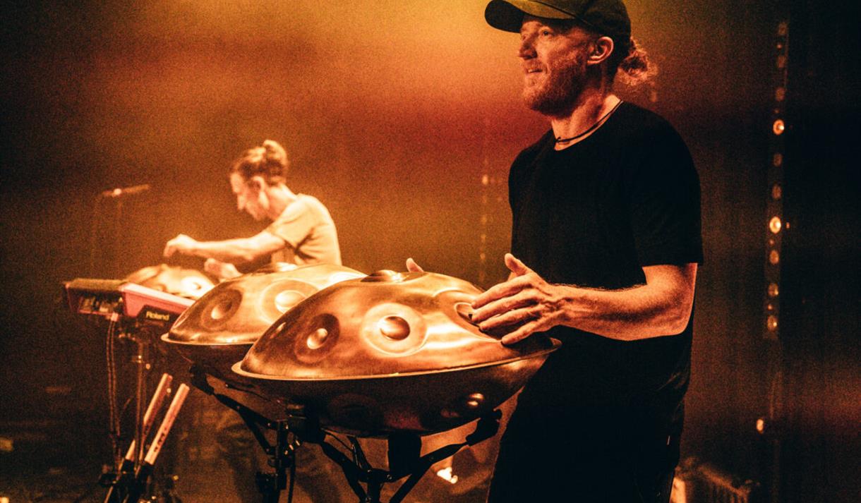 Photo of Hang Massive on stage performing with steel drums