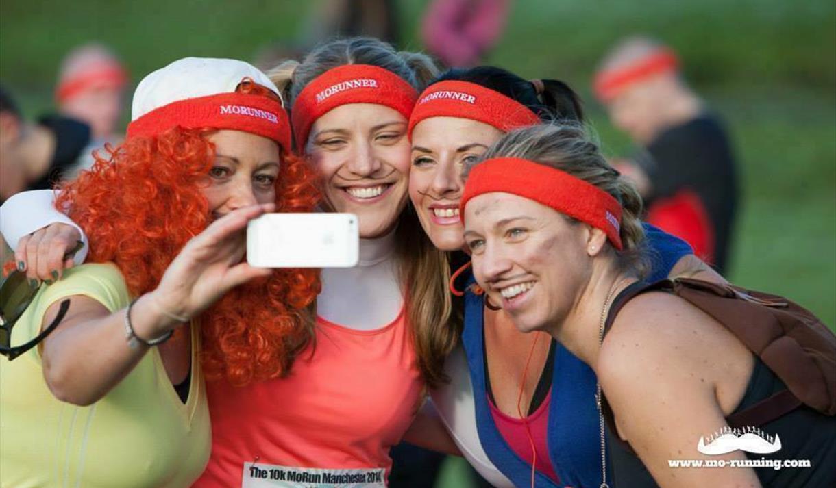 Photo of runners taking a selfie. They are all smiling and some are in fancy dress.