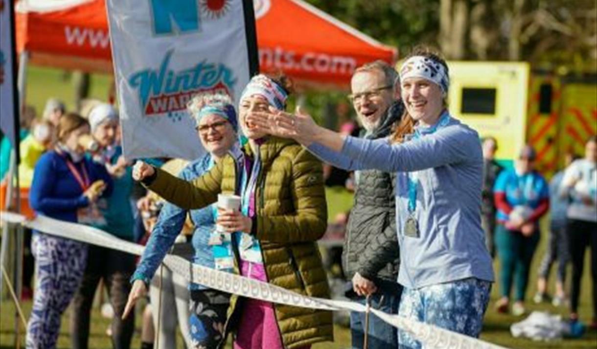 Photo of supporters at the side of the running track