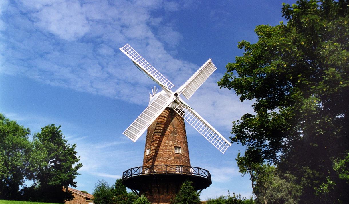 Green's MIll with blue sky behind.