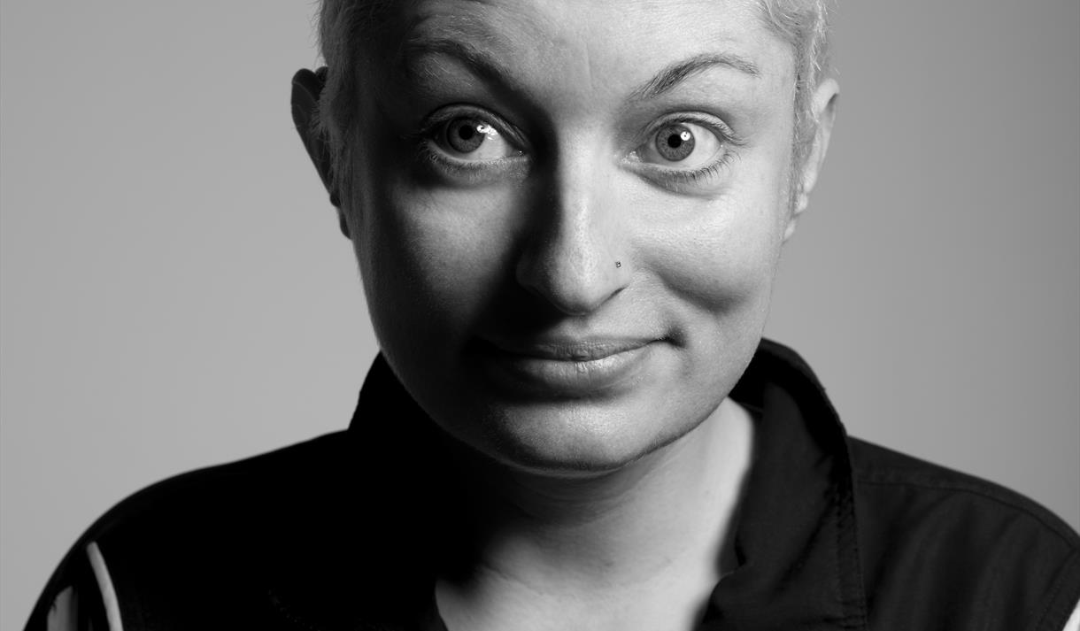 Image shows a headshot of Harriet Dyer