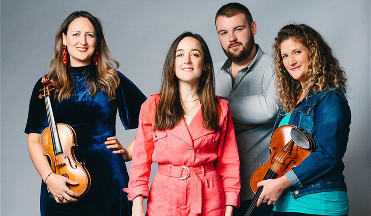 Orkney-born quartet FARA, pictured with violins