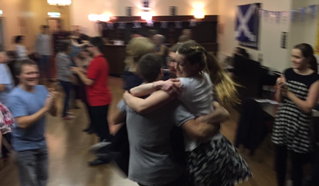 Photo of people joining in a ceilidh