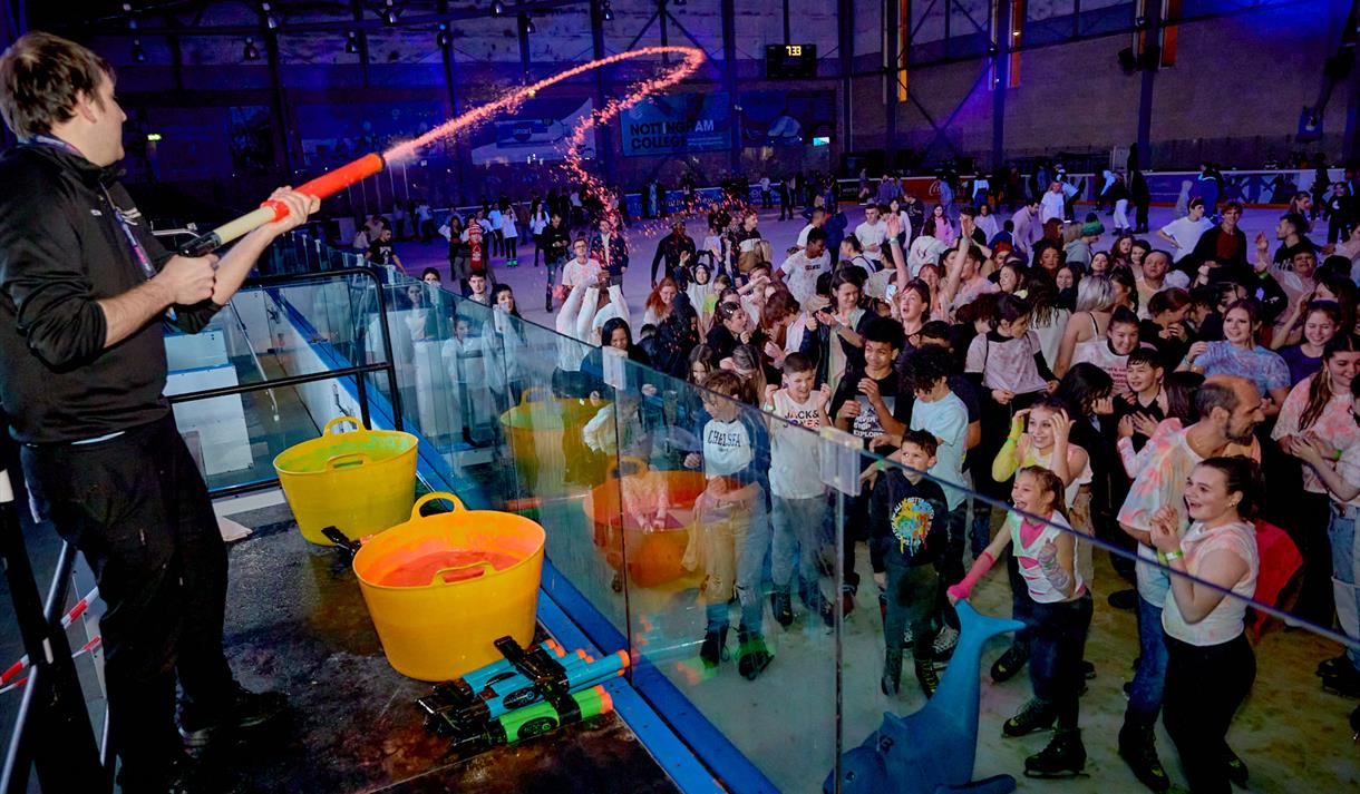 Photo of a UV Paint Ice Skating Party