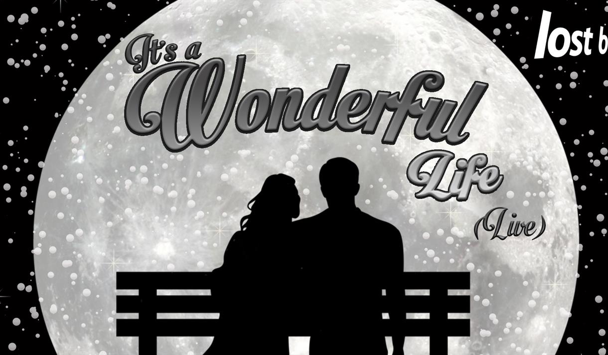 Graphic of a silhouette of a couple looking at a moon