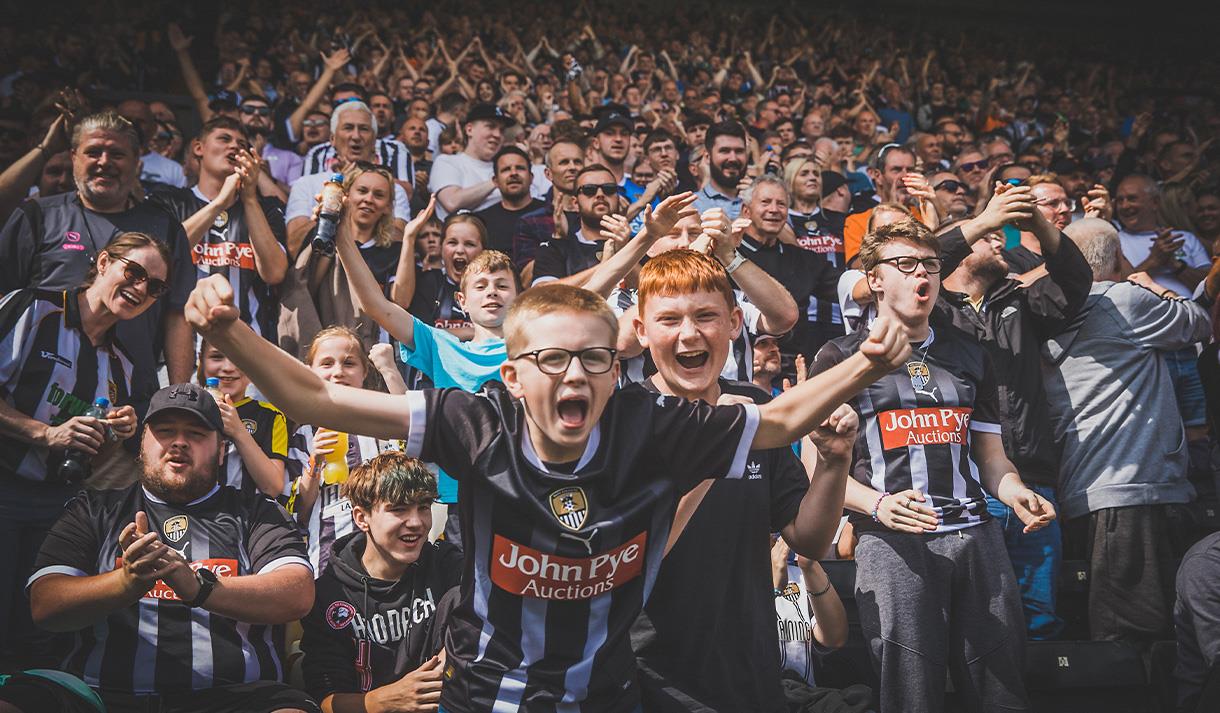 Notts County fans celebrating.