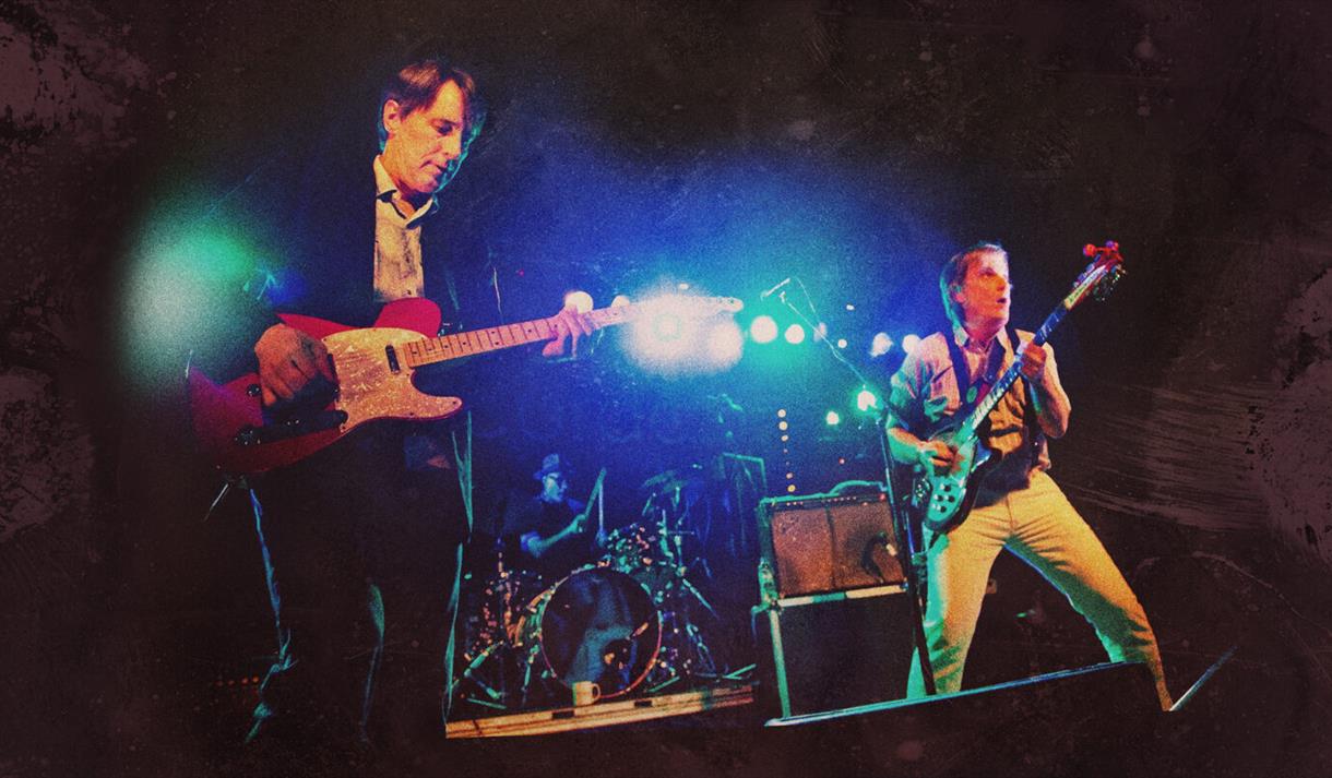 Photo of the Long Ryders performing on stage, guitars in hand
