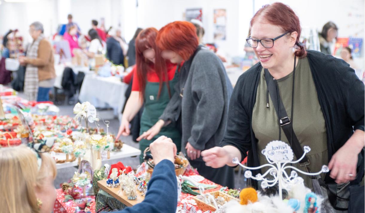 Shopper paying for an item at a Christmas market