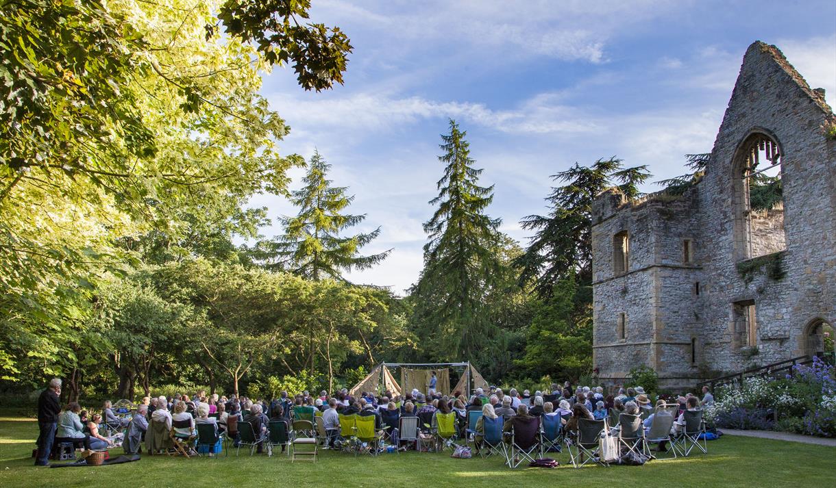 An audience seated in the Palace Gardens at Southwell Minster