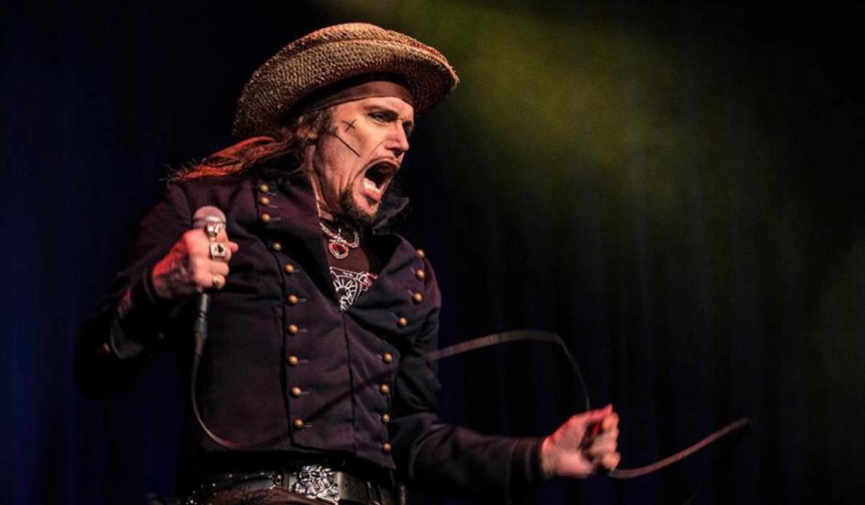 Photo of Adam Ant on stage