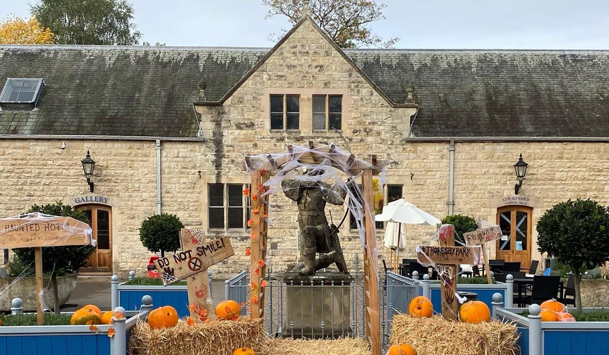 Photo of Thoresby Park with pumpkins in the courtyard