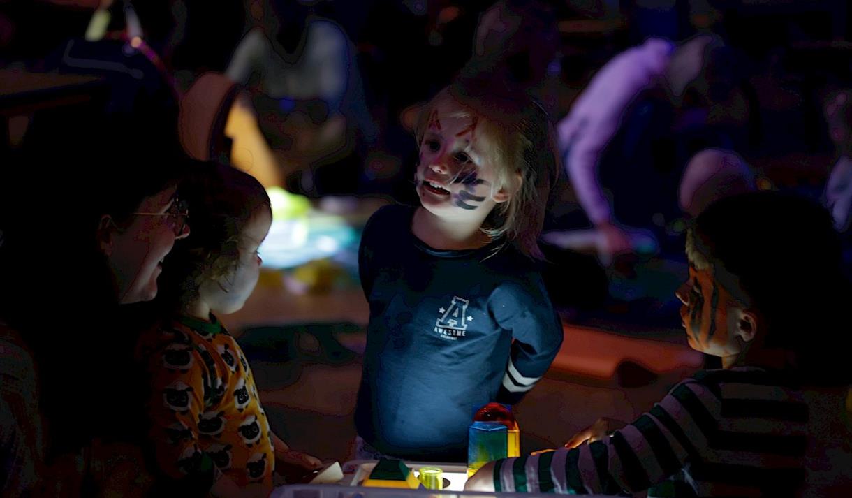 Photo of a child enjoying a sensory play area