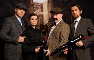 image of people dressed up in 'peaky blinders' get up