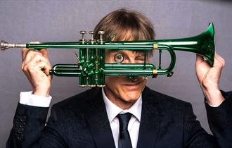 image of Paul Higgs holding a trumpet