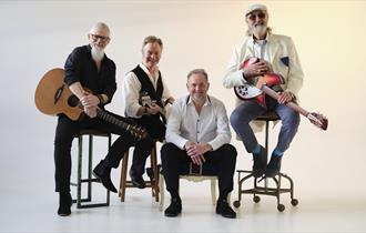 band of four people
